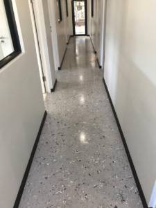 A long office hallway with DECORiTE screed finish